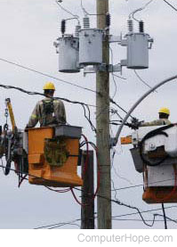 Utility workers fixing electrical power lines