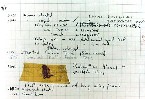 Dead moth taped to a piece of paper in a log book containing notes for the Mark II computer
