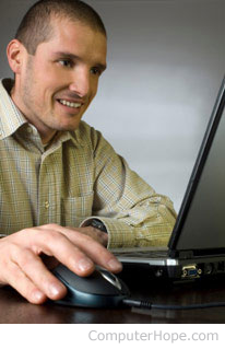 Male freelancer working on a laptop.