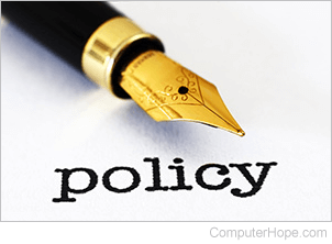 Policy represented by a pen and paper with the word policy written in ink.