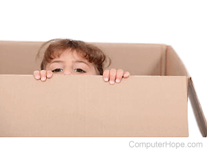 Child peaking out from a cardboard box.