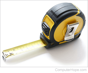 Tape measure with measuring tape pulled out seven inches.