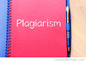 Red notebook with the word Plagiarism on the front cover.