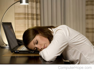 Person asleep waiting for their computer.