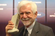 Martin Cooper with his brick cell phone that was the first cell phone.