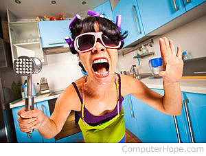 Woman holding a meat tenderizer screaming.