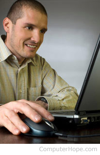 Male freelancer working on a laptop.
