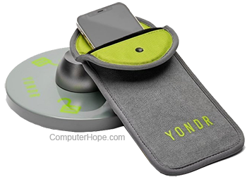 Yondr bag with smartphone and locking device.