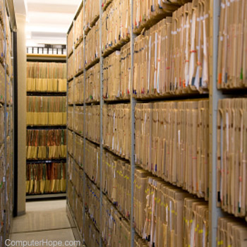 Shelves of hard copy paperwork in an archive