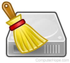 Small broom sweeping off computer equipment