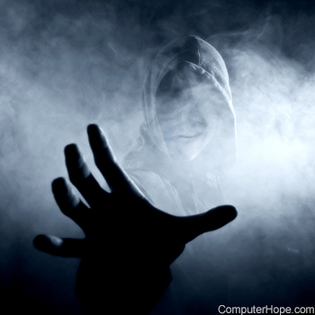 Person wearing hooded outerwear and reaching out in ghostly fog
