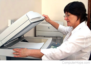 Person using a copy machine.