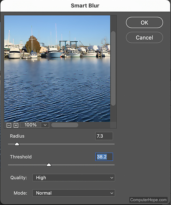 Smart Blur filter settings and example in Adobe Photoshop.